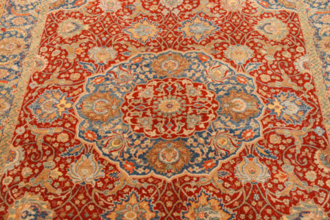 Red and beige oriental rug