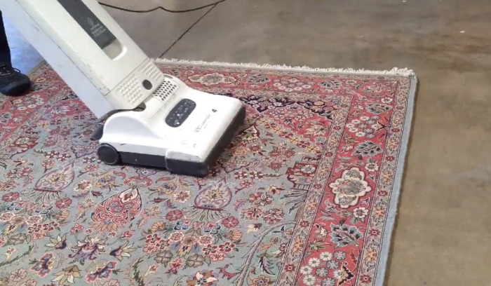 Vacuuming a thick foundation rug