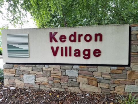 Image of a sign of Kedron Village